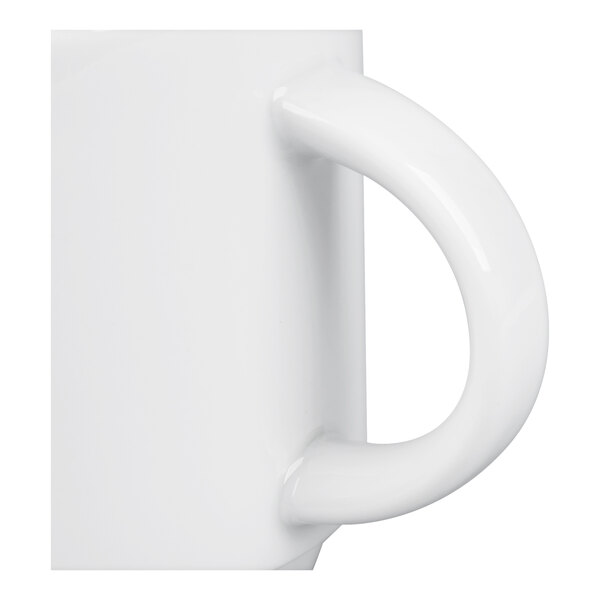 A close-up view of a white ceramic mug handle attached to a smooth, glossy surface.