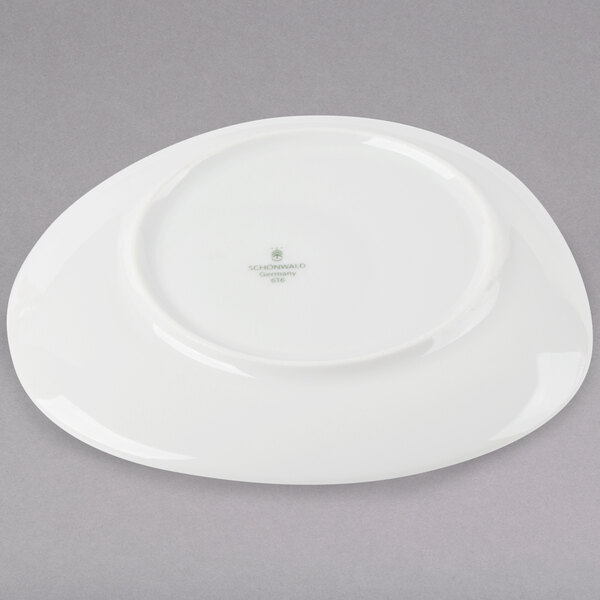 A white Schonwald porcelain saucer.