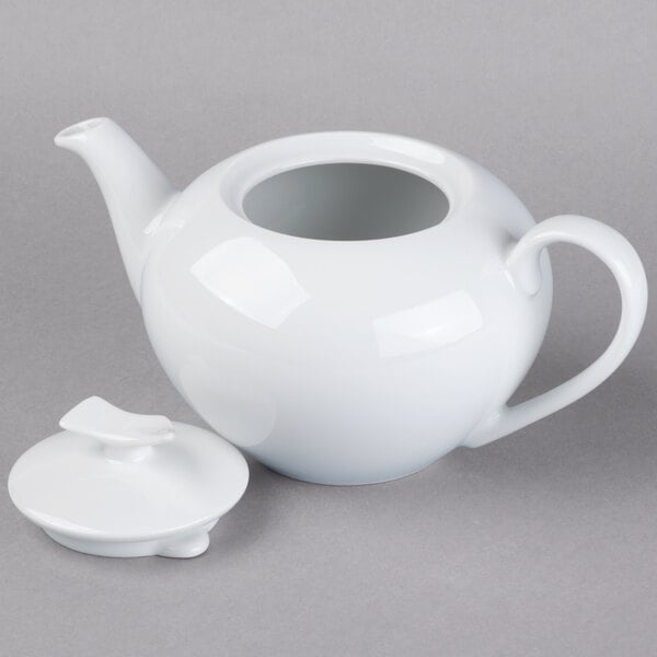 A white Schonwald porcelain teapot with a lid.