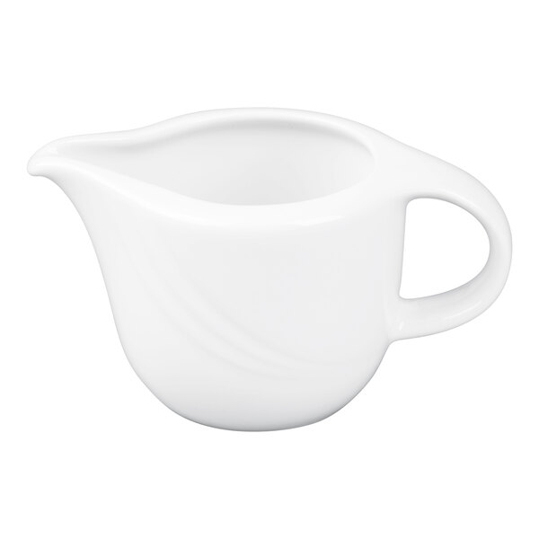 A small white porcelain sauce boat with a handle and spout.