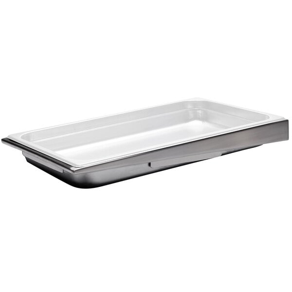 A stainless steel Clipper Mill angled steam pan stand on a white tray.