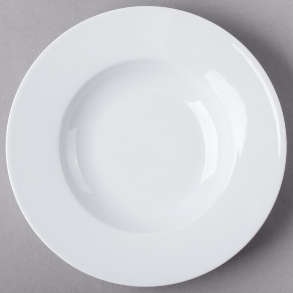 A close-up of a Schonwald white porcelain bowl with a white rim.