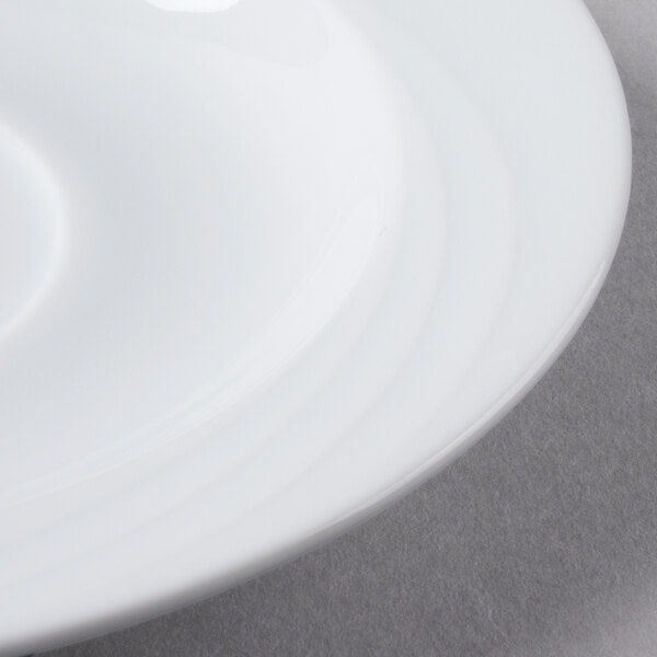 A Schonwald Donna white porcelain saucer with a white rim.