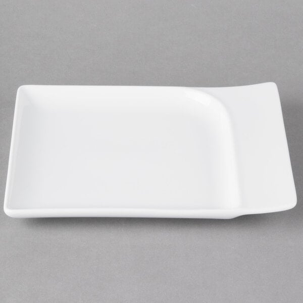 A white rectangular Schonwald china platter with a contoured edge.