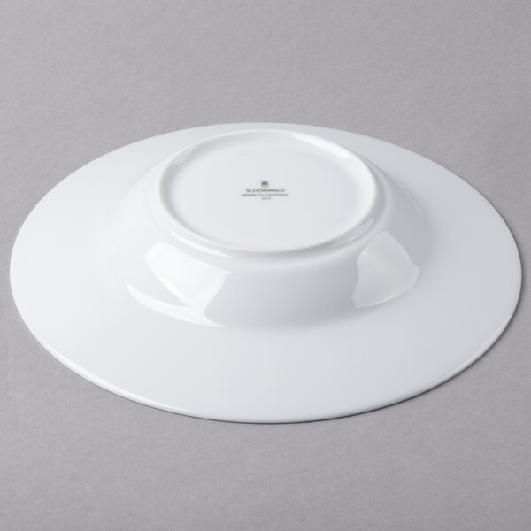 A Schonwald white porcelain bowl with a white rim.