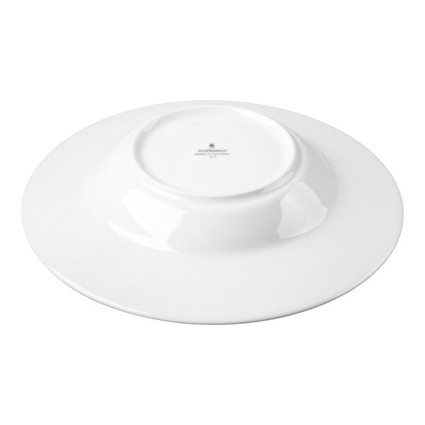 A white porcelain bowl shown upside down on a white background.