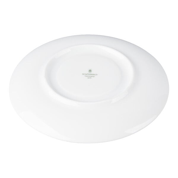 A white porcelain saucer shown from the bottom with a small logo and text at the center.