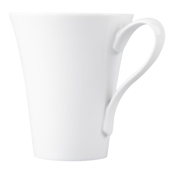 A white porcelain cup with a flared rim and an elegantly curved handle.