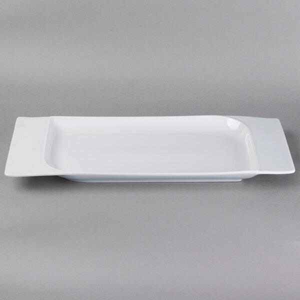 A Schonwald white rectangular porcelain platter with contoured edges.