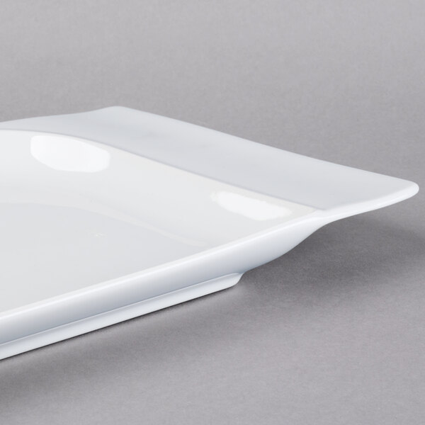 A white rectangular Schonwald porcelain platter with a contoured edge.