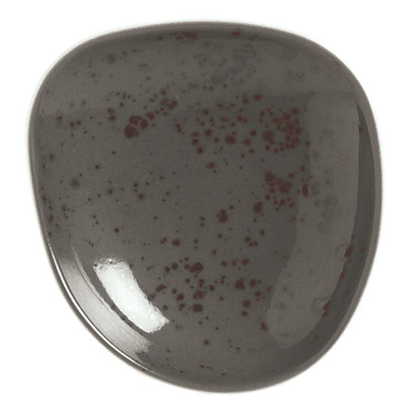 A close-up of a dark gray Schonwald organic porcelain plate with speckles.