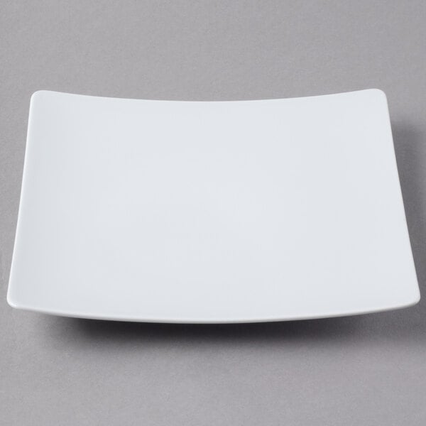 A Schonwald white square porcelain coupe plate with a white rim.