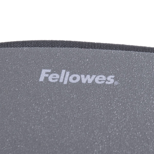 The Fellowes logo on a black mouse pad.