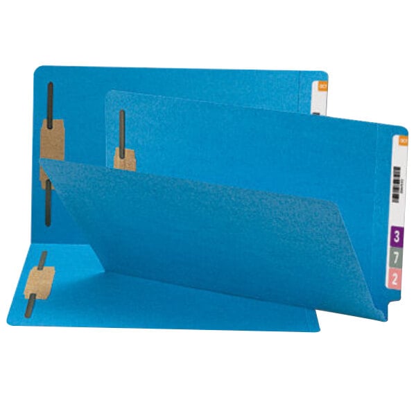 Three blue Smead Shelf-Master folders with tabs on them.