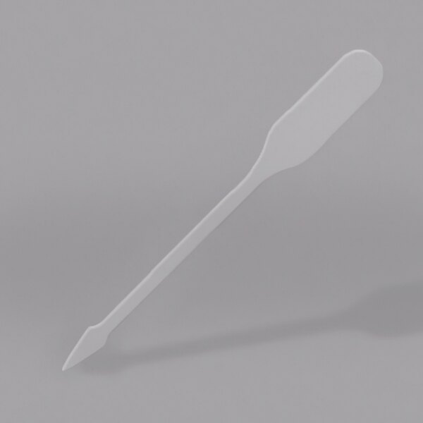 A clear plastic paddle pick with a black border.