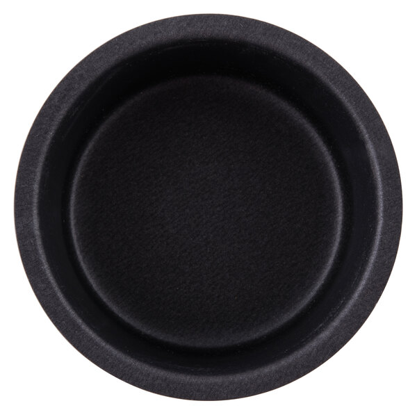 A black Matfer Bourgeat round ramekin mold.
