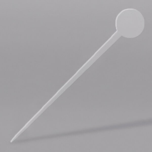 A white plastic stick with a round disc on the end.