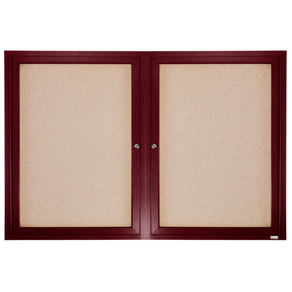 A cork board with a wooden frame.