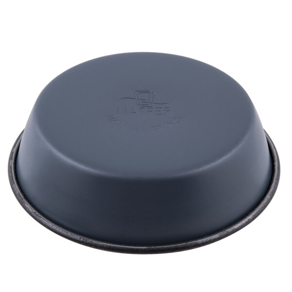 A black Matfer Bourgeat non-stick round mini cake pan with a black rim.