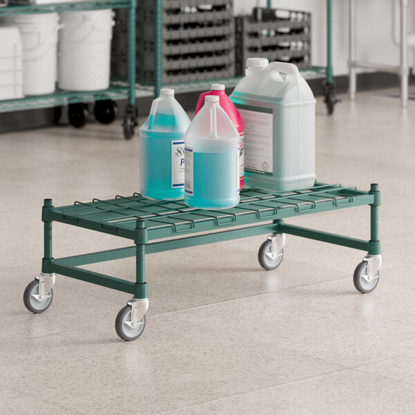 A green Regency dunnage rack with bottles on it.