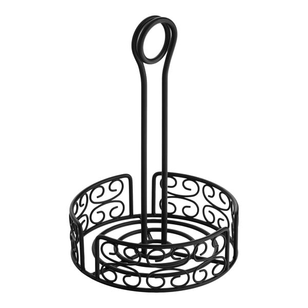 A black round wrought iron condiment caddy with a decorative scroll design and a card holder.
