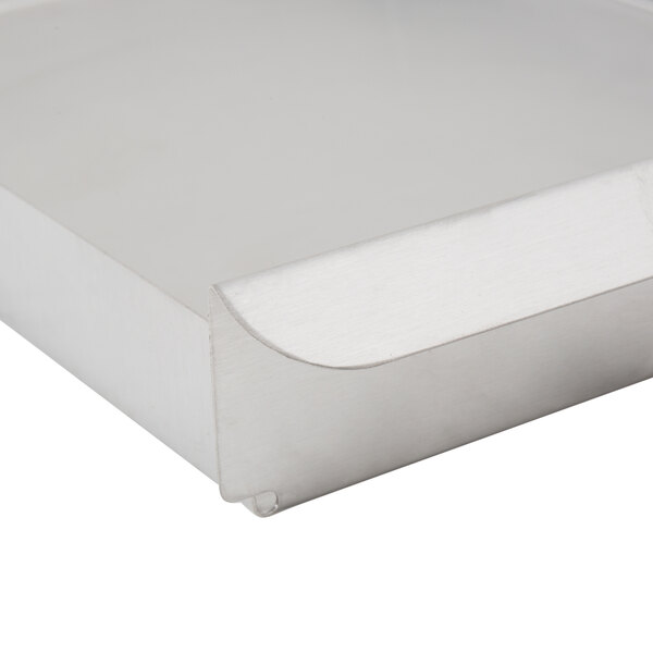 A metal Carnival King crumb tray.