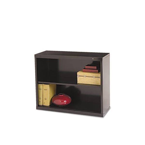 A black Tennsco metal bookcase with books and a vase on the shelves.