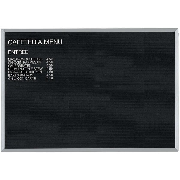 A black Aarco open face message board with white text.
