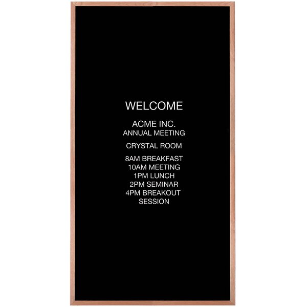 A black felt Aarco message board with white letters reading "Welcome"