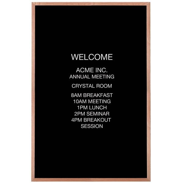 A black Aarco bulletin board with white text reading "Welcome"