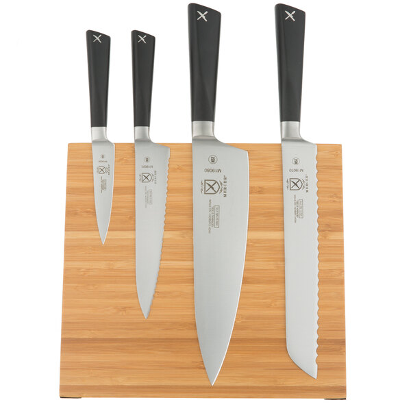 A Mercer Culinary ZüM® knife set on a bamboo magnetic board.
