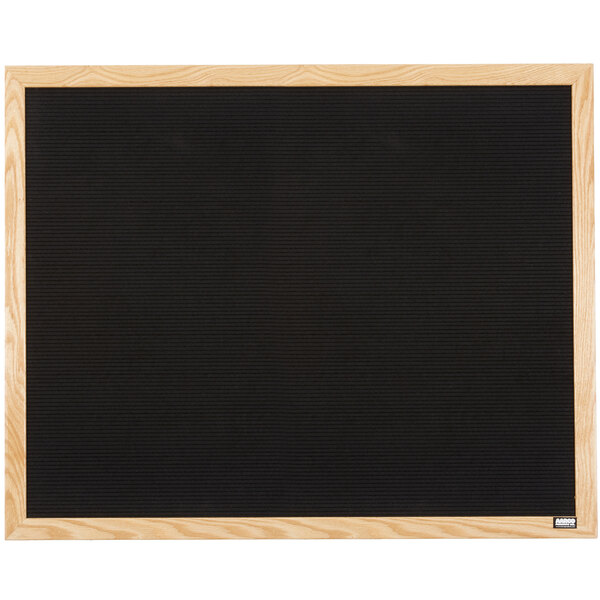 An Aarco black felt open face message board with a wood frame.