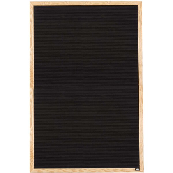 A black rectangular message board with an oak wood frame.