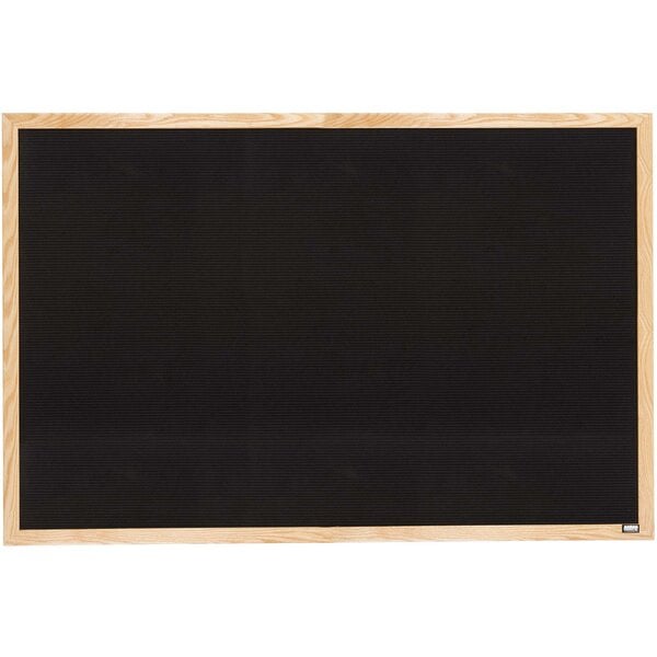 A black board with a wooden frame and white background.