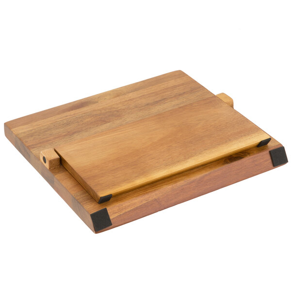 A Mercer Culinary ZüM® acacia wooden cutting board with metal handles.