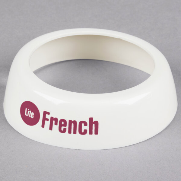 A white plastic Tablecraft salad dressing dispenser collar with maroon lettering.