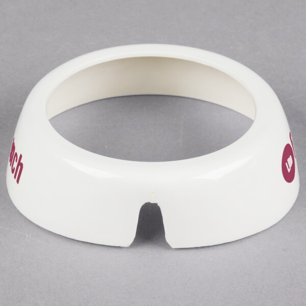 A white plastic Tablecraft collar with maroon lettering.