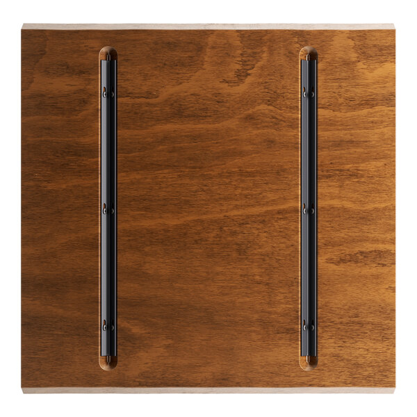 A Lancaster Table & Seating live edge wood table top with a rustic walnut finish.