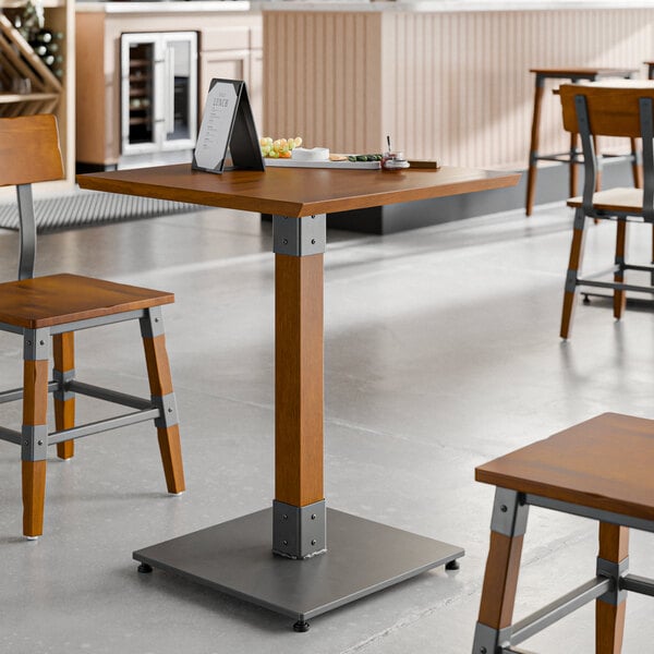 A wooden table with a live edge and a rustic walnut finish on it.