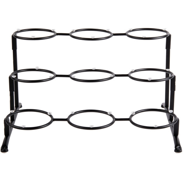 A black metal Libbey 3-tier frame with round wells.