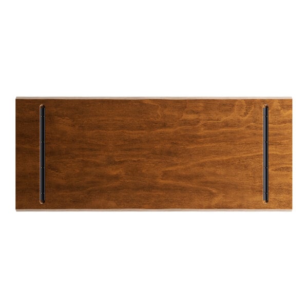 A rectangular wood table top with a live edge and a rustic walnut finish.