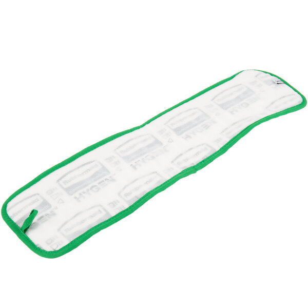 A white and green cloth with a green border and hook and loop attachment.