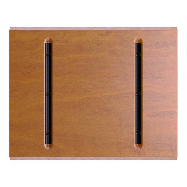 A rectangular wooden surface with a warm brown finish and two parallel black metal strips attached lengthwise.