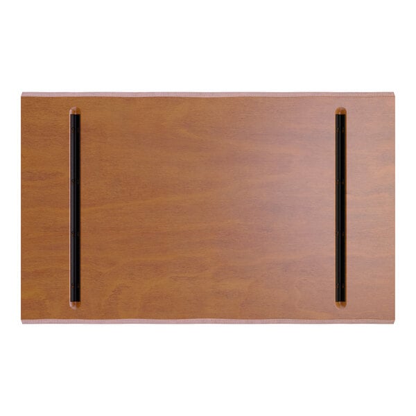 A rectangular wooden tabletop with a warm brown finish and two parallel black metal strips running lengthwise near the edges.