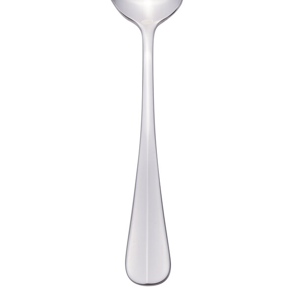 A Libbey stainless steel dessert spoon with a white handle and silver bowl.