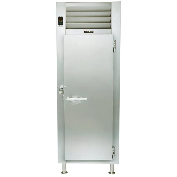 A Traulsen stainless steel Correctional Reach-In Freezer with an open door and vent.