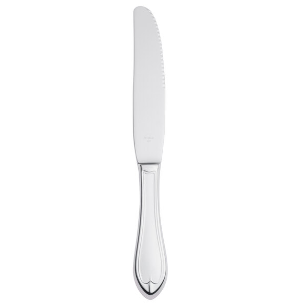 A Libbey stainless steel dinner knife with a fluted hollow silver handle.