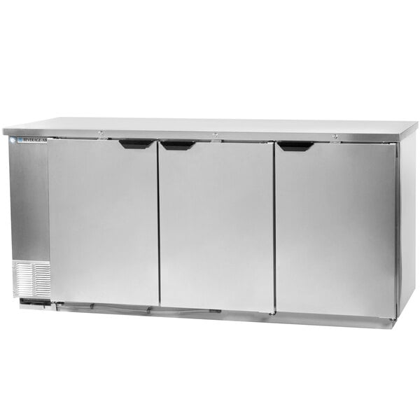 A stainless steel Beverage-Air back bar refrigerator with three solid doors.