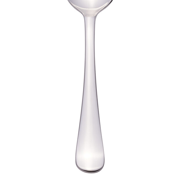 A Libbey stainless steel serving spoon with a white handle.