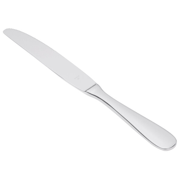 A Libbey stainless steel dinner knife with a serrated solid handle.